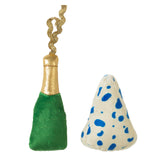 The Quirky Kitty Wine & Cheese Catnip Plush Cat set includes a green champagne bottle with a gold top and ribbon and a cone-shaped white plush with blue spots. Infused with North American catnip, this toy will entertain your feline friend.