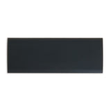 A glossy black rectangular ceramic tile is showcased on a plain white background, mirroring the sleek design of a Petmate Long Replacement Latch for Plastic Kennels.