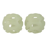 Two identical, spherical, light green Chuckit! Max Glow Air Fetch Ball toys feature an open lattice design and semi-transparent material, with the Chuckit logo embossed for style.