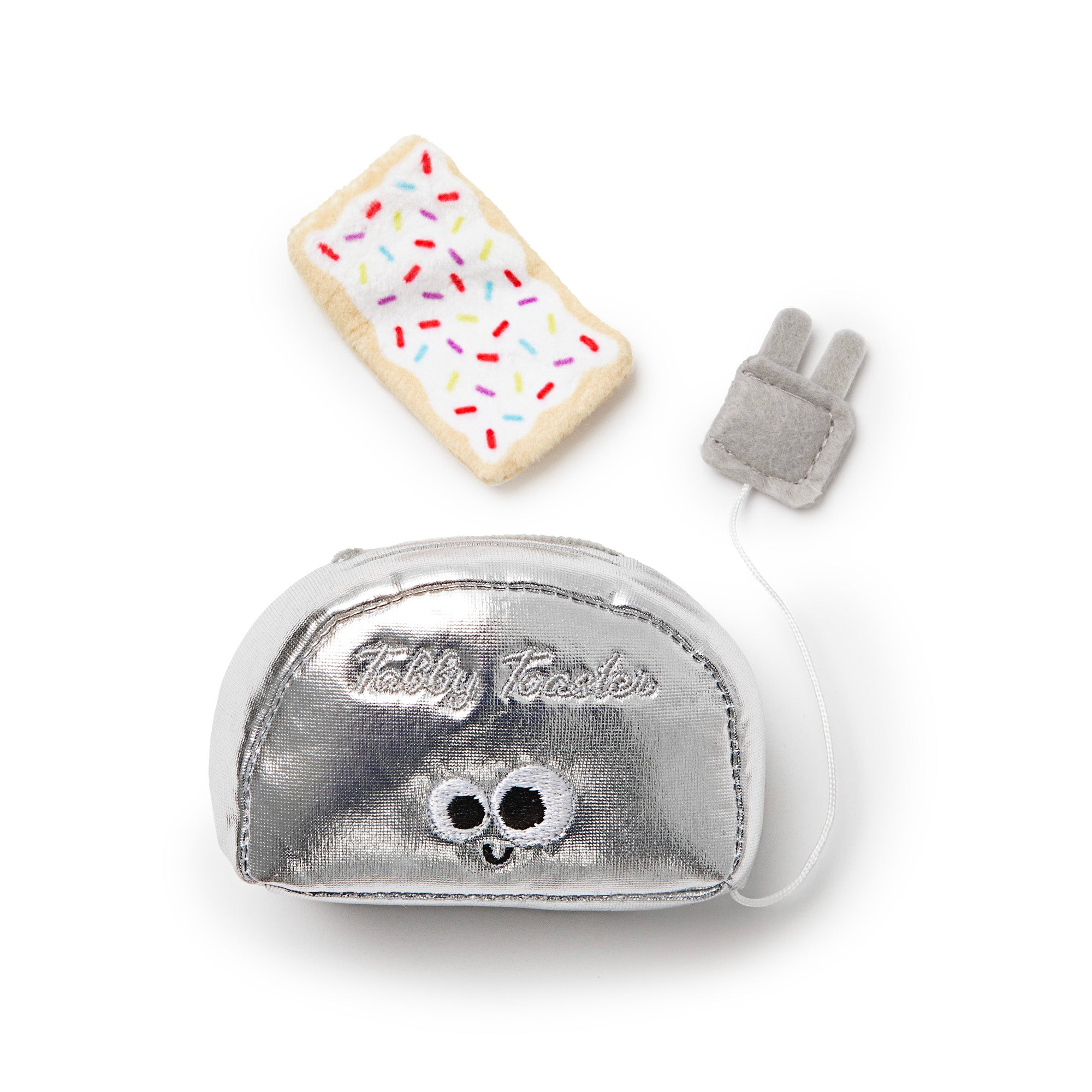 The Mad Cat Buzzing For Breakfast Cat Toy, a plush toaster set, includes a silver smiling toaster, a removable pastry slice, and a soft gray plug with a cord. Infused with Silvernip blend of catnip and silvervine for endless feline fun!.