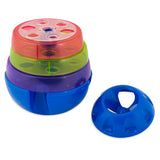The JW Treat Tower Treat Dispensing Dog Toy by Jw is a multi-colored stackable toy with red, green, purple, and blue layers. Each layer features various-shaped holes for learning activities. A handle-equipped treat dispenser sits beside it, offering adjustable playtime challenges.