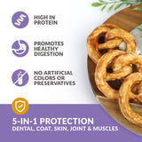 Wild Eats presents Collagen Pretzel Duck Flavor Dog Treats, served on a wooden plate. High in protein, they promote healthy digestion and contain no artificial colors or preservatives. Through hydrolyzed collagen, these chews offer 5-in-1 protection for dental, coat, skin, joints, and muscles.