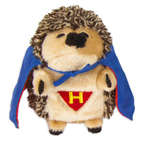 The Zoobilee Super Hero Heggie Dog Toy by Zoobilee features a plush hedgehog dressed as a superhero, complete with a blue cape and red outfit with a yellow H. Its fluffy gray-beige fur, small black eyes, and nose make it ideal for endless hugs.