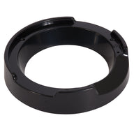 A round, black plastic ashtray with three grooves for holding cigarettes and a smooth, shiny surface reflects light elegantly; it is similar in sleekness to an Aspen Pet LeBistro Automatic Feeder Replacement Food Ring Riser.