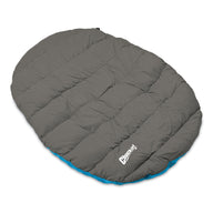 The Chuckit! Travel Pillow Bed, an oval sleeping bag by Chuckit, lies on a white background. It features subtle seams and a white logo at the bottom right corner, with hints of blue on the edges. Portable with a stuff sack and machine washable for easy care.