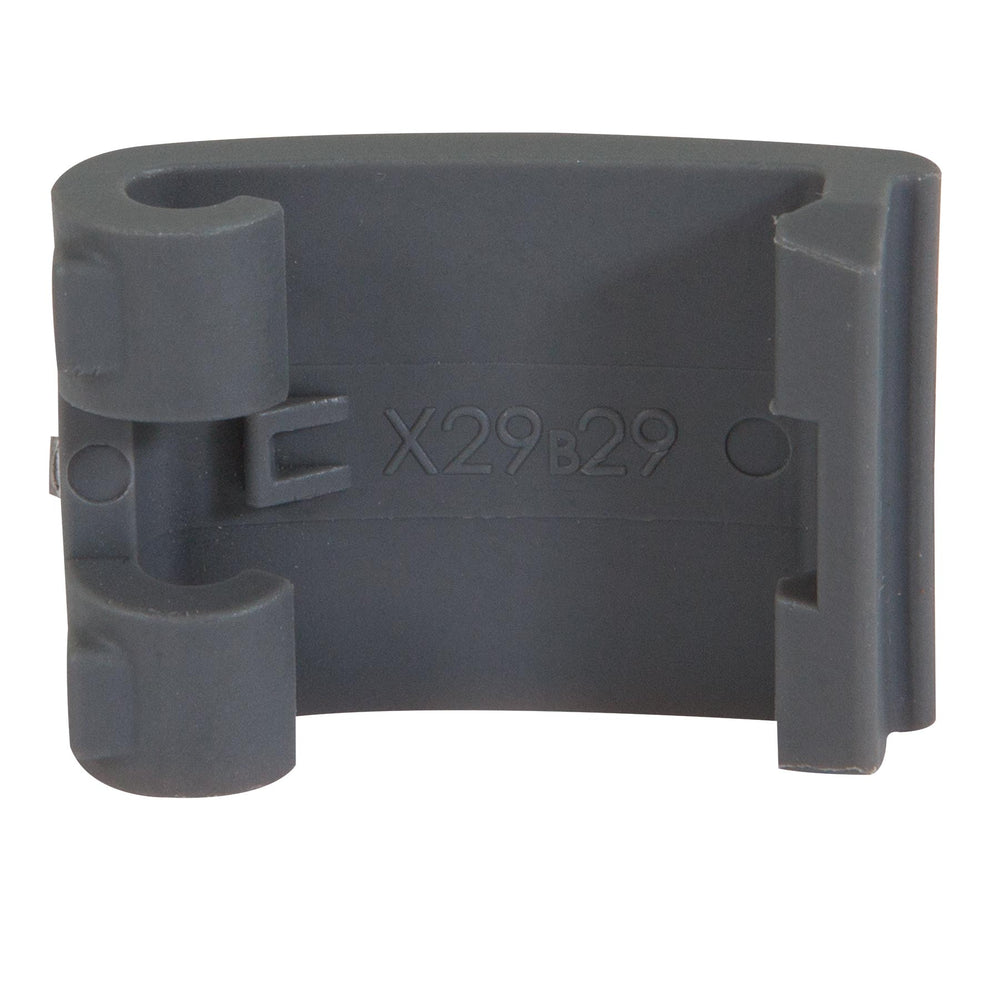 A close-up shows a rectangular dark gray plastic clip with two cylindrical holders, serving as the Short Replacement Latch for Petmate kennels. X29B29 is engraved in the center, featuring a smooth finish.
