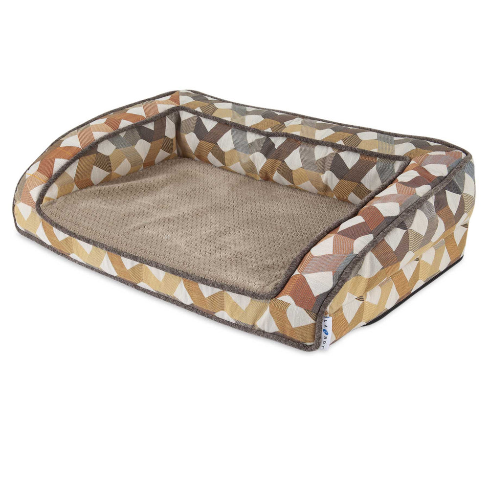 The La-Z-Boy Riley Orthopedic Sofa Dog Bed has a rectangular shape with raised sides and features a geometric pattern in brown, beige, and cream. It is designed for pet comfort with a plush beige fabric interior over supportive gel memory foam.