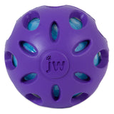 The JW Crackle Heads Crackle Ball Dog Toy by Jw features a purple rubber exterior with circular cutouts revealing a blue layer underneath. This embossed jw toy has a textured, geometric design making it perfect for interactive playtime with pets.