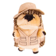 Meet the Zoobilee Fisherman Heggie Dog Toy—an adorable plush hedgehog perfect for playtime. This durable little adventurer features a beige hat and matching vest with pocket details, a round fluffy body of brown and cream fur, a small black nose, and paw accents.