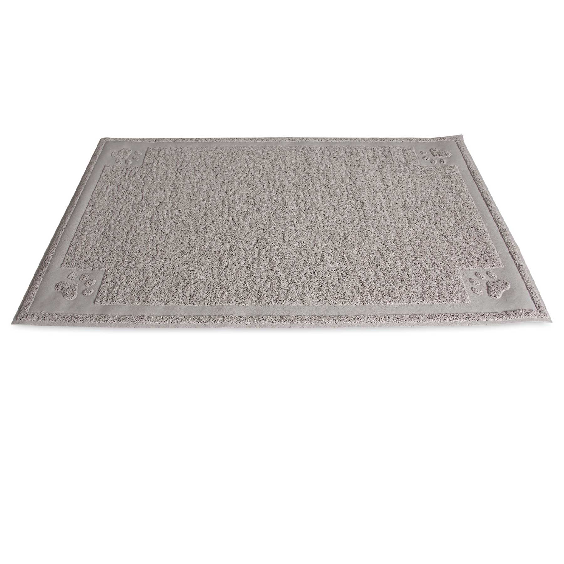 The Petmate Paws Large Litter Catcher Mat in tan is displayed. Made from soft, rubberized material, it has a rectangular textured surface with a subtle border and decorative raised paw prints at the corners. BPA and phthalate-free, it seamlessly lies on a white background.