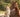 A dog and a horse standing together in a field