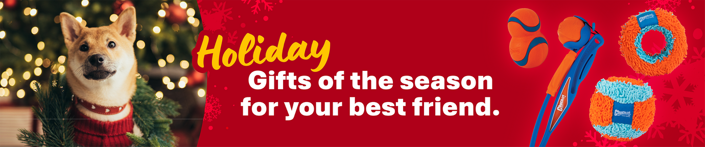 A yellow Labrador lies beside a pet carrier with a red bow, near a decorated Christmas tree. Text reads: Find the perfect holiday gifts for your best friend. Shop now. Petmate.