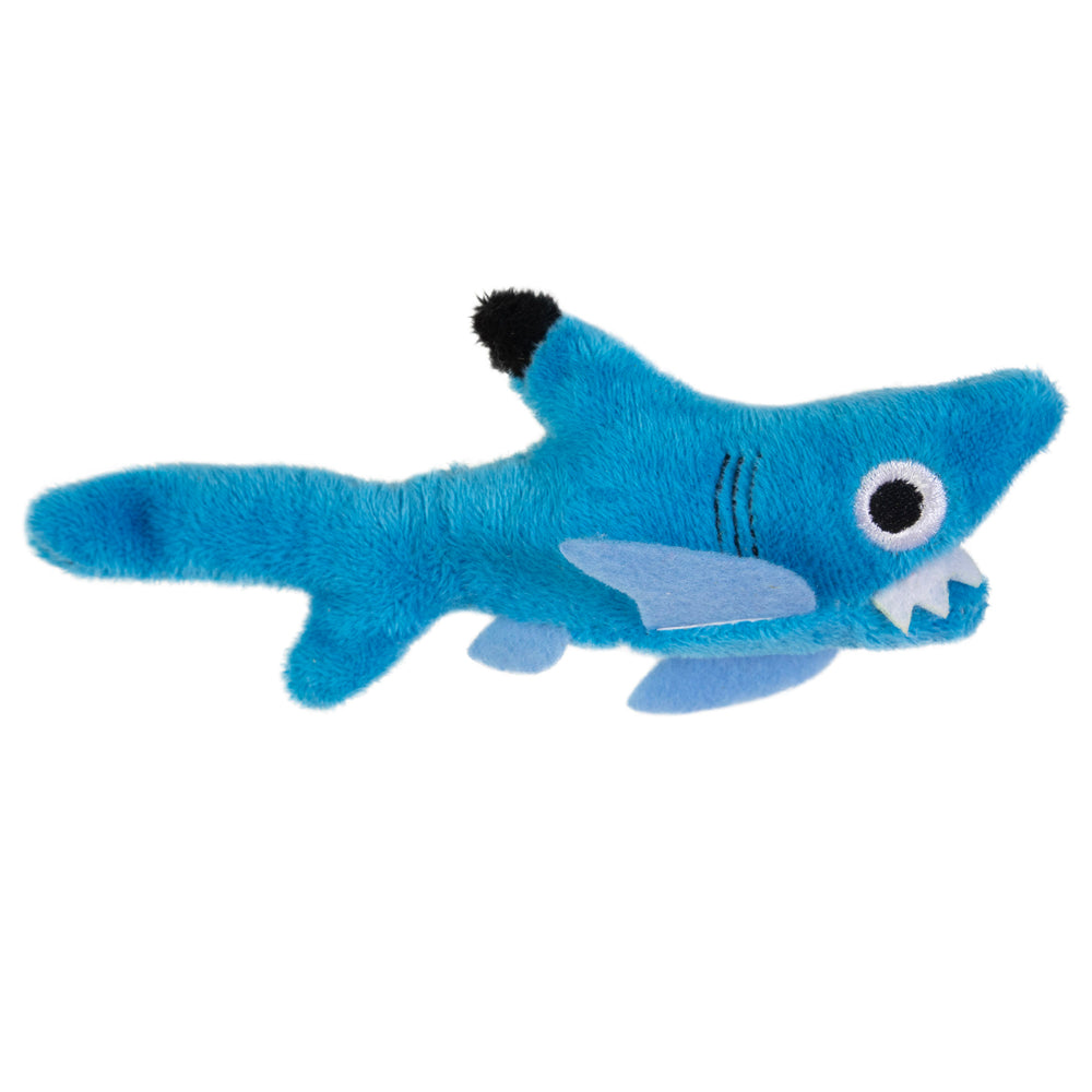 The Mad Cat Shark Biter Catnip & Silvervine Cat Toy is a plush, blue shark with cartoonish features like a wide-open mouth, large white teeth, one round eye, and two light blue fins. Infused with catnip, this toy is the perfect playful surprise for your feline friend.