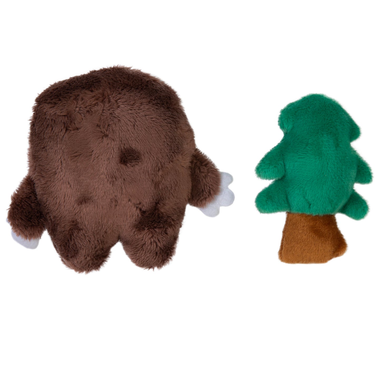 The left plush toy is a Mad Cat Sasquatch, resembling a brown rotund creature with small limbs. The right toy resembles a green tree with a brown trunk. Both are Mad Cat catnip-infused toys made of soft, fuzzy material perfect for playful cats.