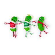 Three Quirky Kitty® Dancing Pickles plush cat toys with arms and legs, each dressed in a festive holiday outfit.