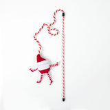 A Quirky Kitty® On Dancer On Prancer Wand cat toy featuring a red and white striped wand with a dangling plush Santa character.