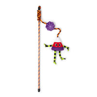The Quirky Kitty® Dancing Candy Corn Wand Cat Toy features a striped handle with a candy corn character and a small purple spiderweb attached by a cord, perfect for interactive Halloween play.
