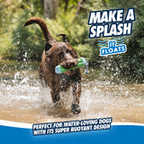 A brown dog joyfully splashes through the water, holding a Chuckit! Amphibious Bumper Floating Dog Toy in its mouth. Text reads, Make a splash, it floats high, and Perfect for water-loving dogs seeking interactive play with its super buoyant design. Green trees and bushes are in the background.