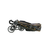 The Gen7Pets Gold Nugget Promenade Pet Stroller features a folded black and gold design with a Smart-Comfort Pad, golden dot pattern, sleek all-terrain wheels, and visible handle.