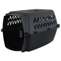 The Aspen Petmate Pet Porter is a dark green carrier with a black metal front door, circular ventilation holes on the sides and top, and a quick-latch system. It meets airline standards for safe and comfortable transport of small animals.