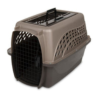 The Petmate E-Z Load Two Door Dog & Cat Kennel by Petmate is a brown and beige plastic pet carrier with a black metal door, side air holes, and a top handle. The door is open, showing the empty interior.