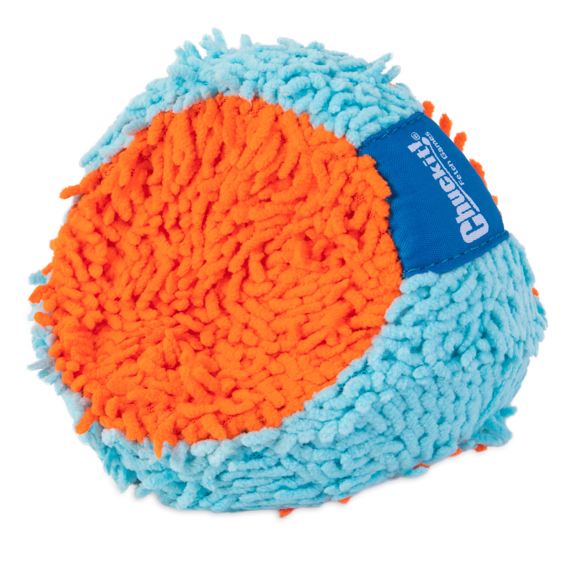The Chuckit! Indoor Fetch Tumbler Toy for Dogs, by Chuckit, features a textured ball with fuzzy blue and orange patches and a small blue tag. Its surface has protruding fibers, making it soft and tactile, ideal for indoor fetch sessions with the Chuckit! Indoor Launcher.