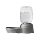 The Petmate Replendish Pet Waterer With Microban by Petmate is a gray automatic pet water dispenser with a clear bottle and filter, designed to keep your pet’s bowl refilled and water fresh. Shown on a white background.