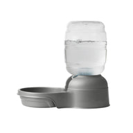 The Petmate Replendish Pet Waterer With Microban by Petmate is a gray automatic pet water dispenser with a clear bottle and filter, designed to keep your pet’s bowl refilled and water fresh. Shown on a white background.