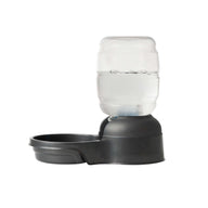 The Petmate Replendish 0.5 Gallon Filtered Pet Waterer by Petmate is a black plastic dispenser with a clear inverted bottle, offering automatic gravity refill for continuous pet hydration. Shown on a plain white background.