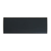 A glossy black rectangular ceramic tile is showcased on a plain white background, mirroring the sleek design of a Petmate Long Replacement Latch for Plastic Kennels.