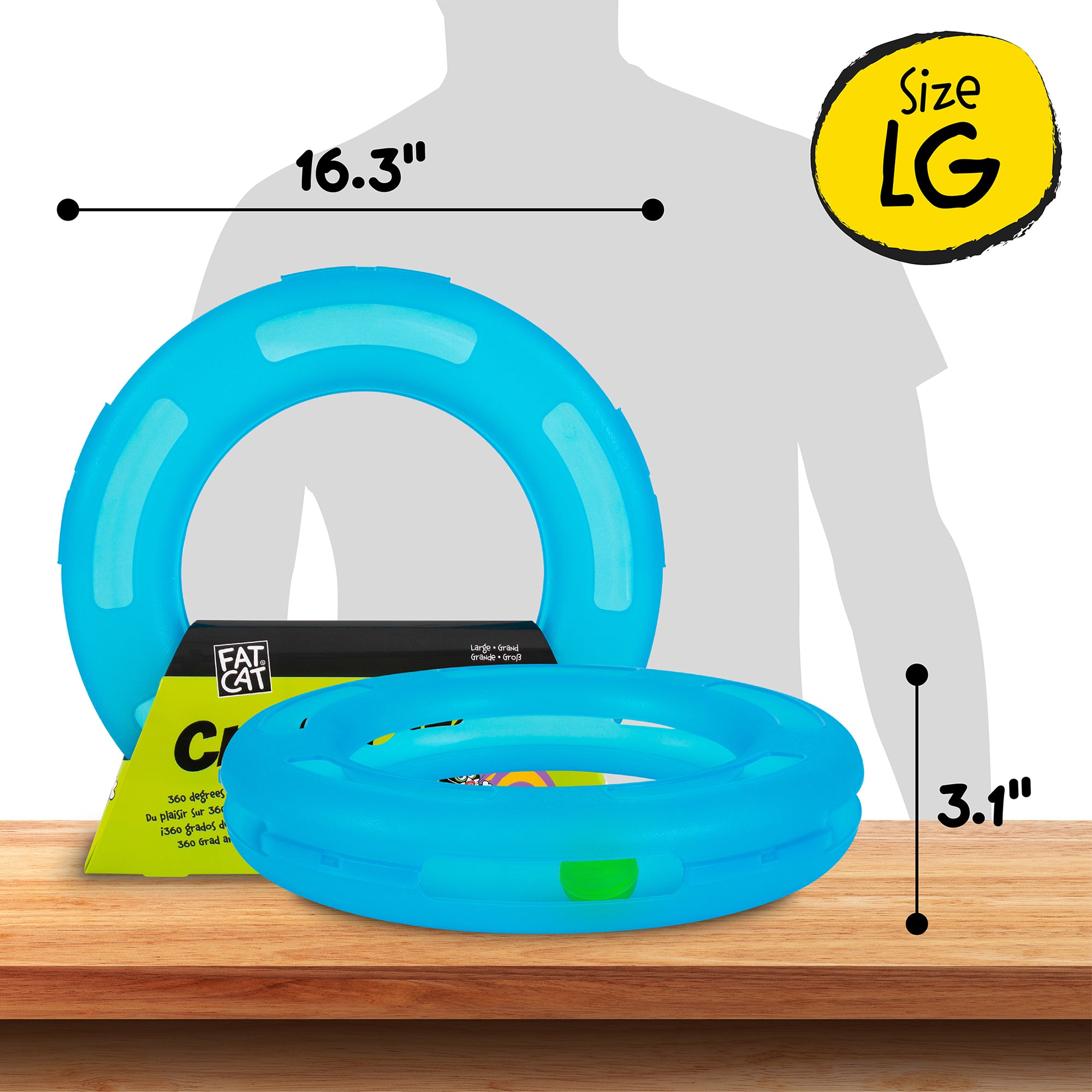 A Fatcat Crazy Circle Cat Toy, doubling as an exercise toy, is blue and circular, with a 16.3-inch diameter and 3.1-inch height. Labeled Size LG, it rests on a wooden surface with a silhouette behind it. A yellow tag reads FAT CAT.