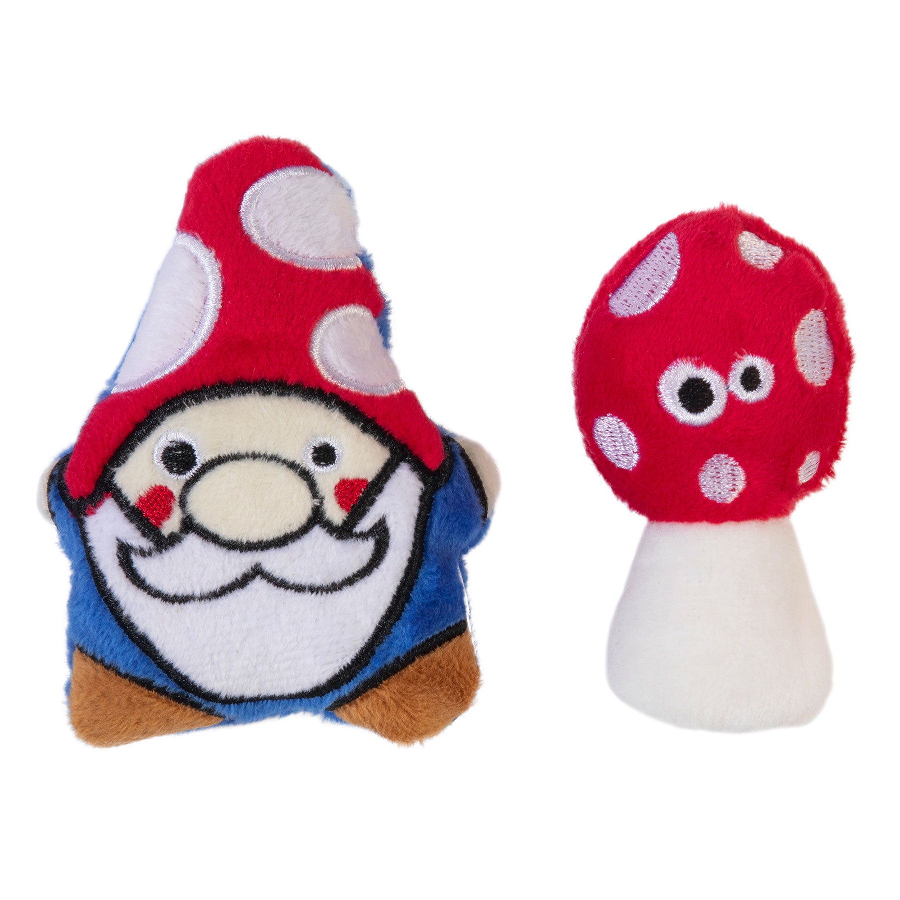 The Mad Cat Gnome Sweet Gnome Cat Toy 2 Pack includes a plush gnome with a red hat and white spots, and a red mushroom with white spots and googly eyes, both infused with premium catnip. Their soft, fuzzy textures provide a playful alternative to traditional catnip for your feline friend.