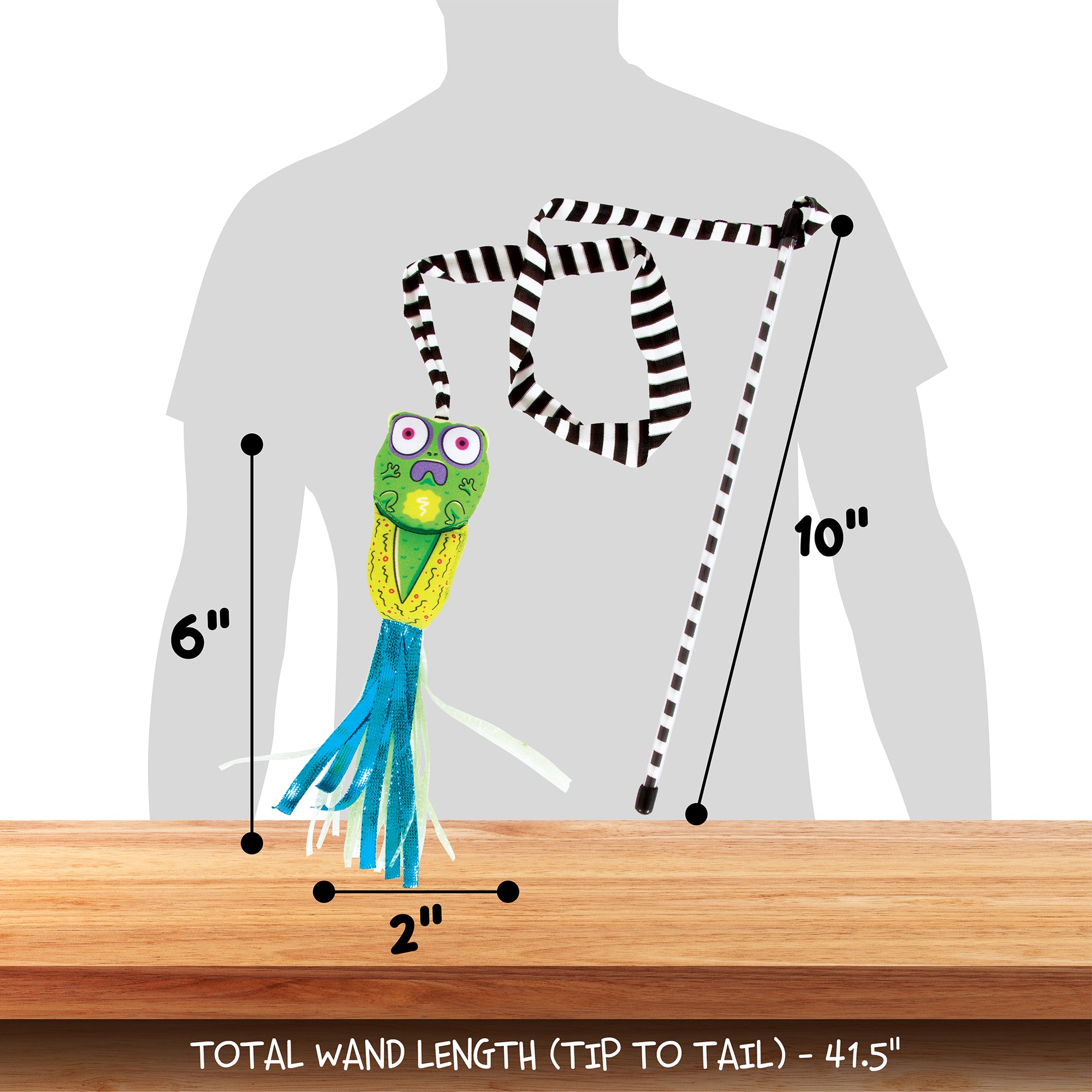 A silhouette of a person displays the FAT CAT Catfisher Teasers - Tadpole Cat Wand by Fatcat; ideal for interactive play, it features a 6 green frog head with tassels attached to a 41.5 striped wand, an organic catnip-infused 10 rope, and has a width of 2.