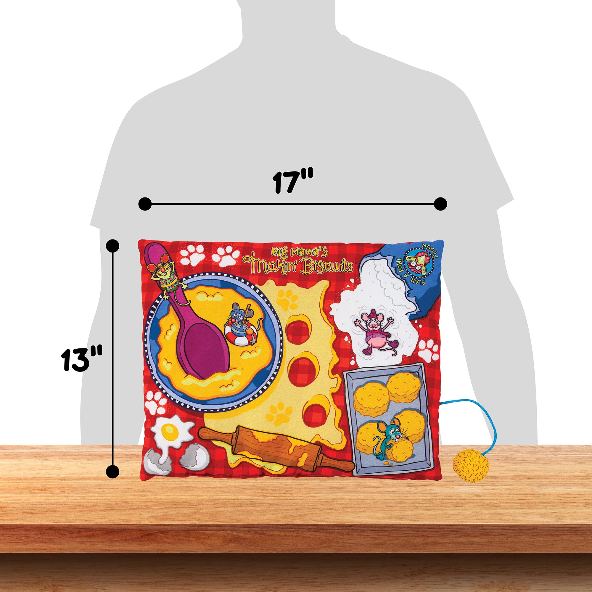 The FAT CAT Big Mamas Makin Biscuits Boogie Mat from Fatcat, 17 by 13 inches, features pretend food items, utensils, and playful characters set on a vibrant background, displayed on a wooden table.