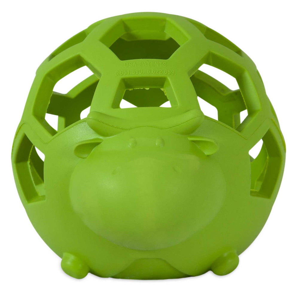 The green JW Hol-ee Cow Dog Toy by Jw features a cartoon hippo face, hexagonal cutouts, and a round design. Lightweight and ideal for small dogs, its perfect for chewing and playtime fun.