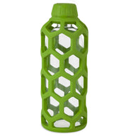 A glass bottle wrapped in a honeycomb-patterned silicone sleeve offers grip and protection, featuring nature-inspired green and a matching cap. Made with non-toxic rubber, its as safe as your favorite JW Hol-ee Water Bottle Dog Toy when upright and empty.