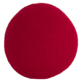 A bright red, textured JW Wool-ee Ball by Jw, resembling a fabric-covered sphere, is centered against a plain white background. This biodegradable toy doubles as an antimicrobial plaything, offering both fun and cleanliness.