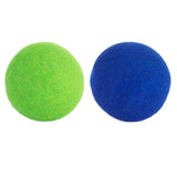 Two JW Wool-ee Balls, one bright green and the other deep blue, rest on a white background. Both are fuzzy, biodegradable, and combine irresistible softness with sustainability.