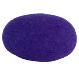 An oval purple felt pillow, resembling the JW Wool-ee Football, sits on a white background. Its fuzzy texture and vibrant color create a soft and inviting look while featuring antimicrobial properties for enhanced freshness.