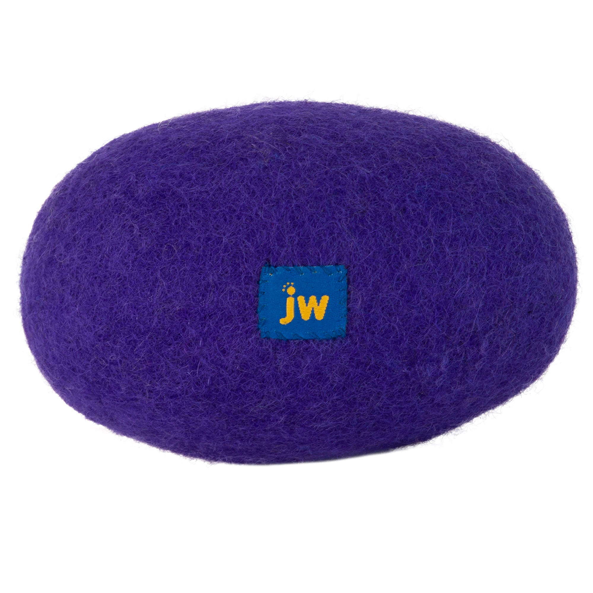 This oval-shaped dog toy, resembling a rock or cushion, is made of purple felted wool and features a small blue square tag labeled jw. Crafted like the JW Wool-ee Football, its antimicrobial properties make it an ideal choice for pets.