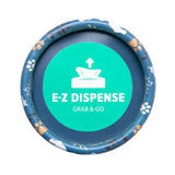 The Arm & Hammer Gotta Go Waste Bag Dispenser by Arm And Hammer features a round lid with a teal label displaying a napkin icon alongside the words “E-Z DISPENSE” and “GRAB & GO.” Its edge is decorated with a blue animal paw print pattern, making it ideal for carrying fresh-scented waste bags that provide effective odor control.