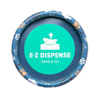 The Arm & Hammer Gotta Go Waste Bag Dispenser by Arm And Hammer features a round lid with a teal label displaying a napkin icon alongside the words “E-Z DISPENSE” and “GRAB & GO.” Its edge is decorated with a blue animal paw print pattern, making it ideal for carrying fresh-scented waste bags that provide effective odor control.