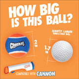 A blue, orange, and white Chuckit! ball (2") sits beside a 1.7" golf ball. Also shown are the Chuckit! dog ball launcher and the Chuckit! Cannon & Cannon Max Dog Ball Launcher by Chuckit!.