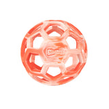 The Chuckit! Hol-ee Roller is a red and white rubber dog toy with a honeycomb pattern, open hexagonal holes, and the Chuckit! brand name displayed in the center.