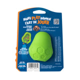 A green Chuckit! Tumble Teez Dog Treat Puzzle Toy with a hexagon pattern for dogs up to 40 lbs is attached to blue packaging featuring "Make Play Happen," a dog photo, puzzle info, care details, and mental stimulation benefits.