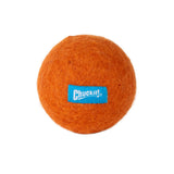 A Chuckit! Wool-ee Ball dog toy, orange and fuzzy with a blue Chuckit! label, is shown on a white background—an eco-friendly toy made from natural wool.