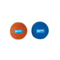 Two fuzzy Chuckit! Wool-ee Balls, made from natural wool, are displayed side by side on a white background—one orange, one blue. Each features the blue Chuckit! logo label and offers an eco-friendly dog toy option.