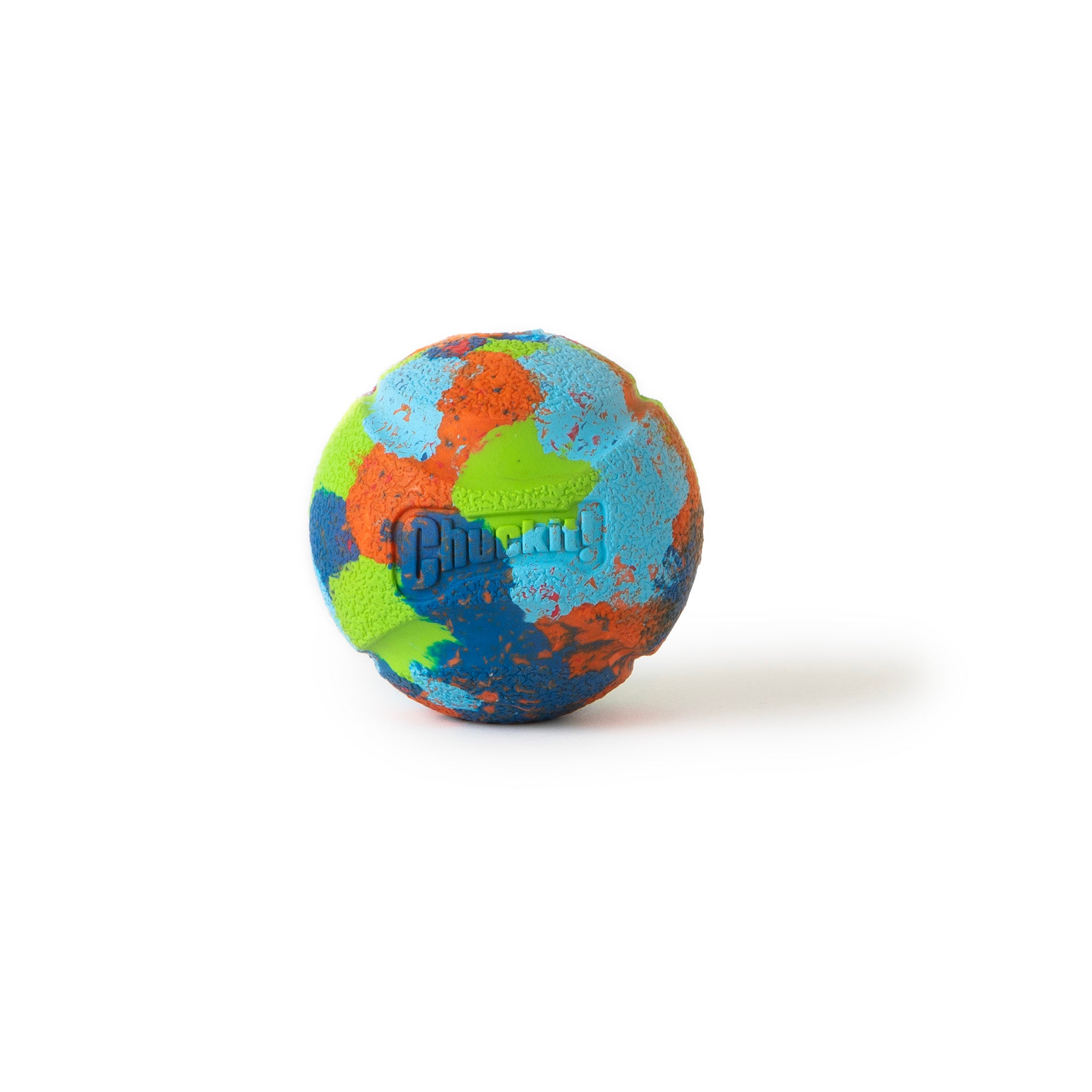 The Chuckit! EcoFetch Recycled Rubber Fetch Ball Medium, crafted from recycled rubber, features blue, green, red, and orange splotches. The Chuckit brand name is embossed on its surface. Ideal for Chuckit Launchers, it is showcased against a plain white background.