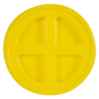The Gamma2 GAMMA Seal Lid is a yellow, round lid made from BPA-free HDPE plastic with a glossy finish. It has four recessed sections forming a cross at the center and provides an airtight seal, fitting snugly on containers or buckets.