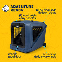 A blue Petmate Basecamp Travel Kennel featuring a wire-grid door, kayak-style carry handles, nautical-style tiedown cleats, an escape-proof door, and removable wheels.